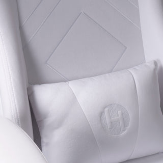 Close up of the velvet white gaming chair to display the removeable lubar support pillow in a matching white velvet material. 