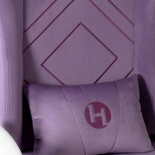 Close up of the velvet purple gaming chair to display the removeable lubar support pillow in a matching purple velvet material.