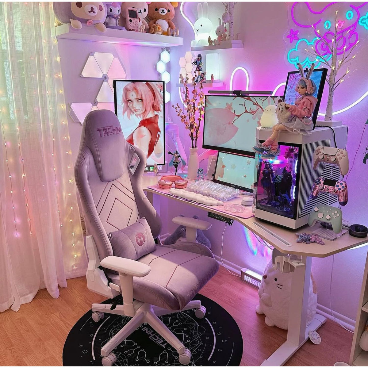 Purple Gaming setup with a chair, desk, and computer monitors in a room with decorative elements. 