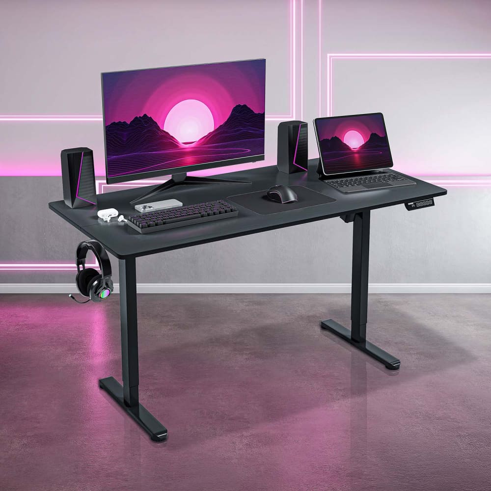 Black adjustable standing desk with electronics.