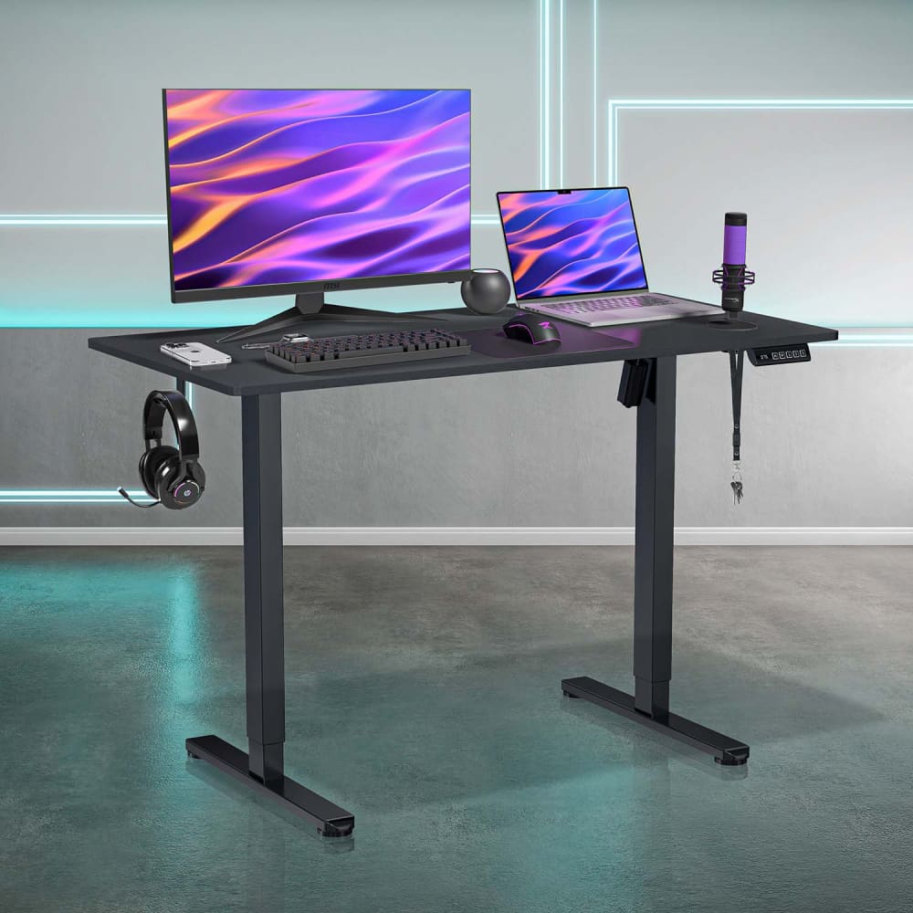 Black adjustable standing desk.