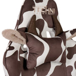 Brown cow gaming chair closeup of pillow with horns and ears