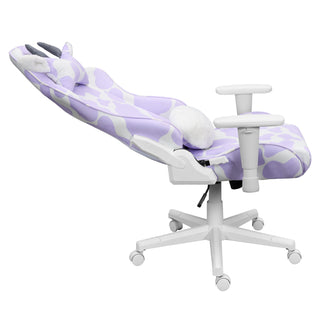 Purple cow gaming chair shown in a full 150 degree recline against a white background. This light purple gaming chair has white hardware such as 2d armrests, base, wheels and casters. 