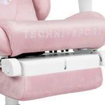 Close up of pink gaming chair with tuck-away footrest.