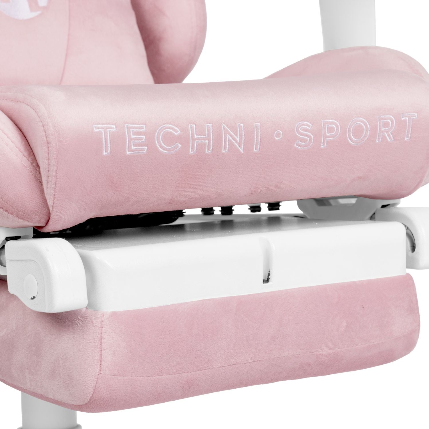 Close up of pink gaming chair with tuck-away footrest.