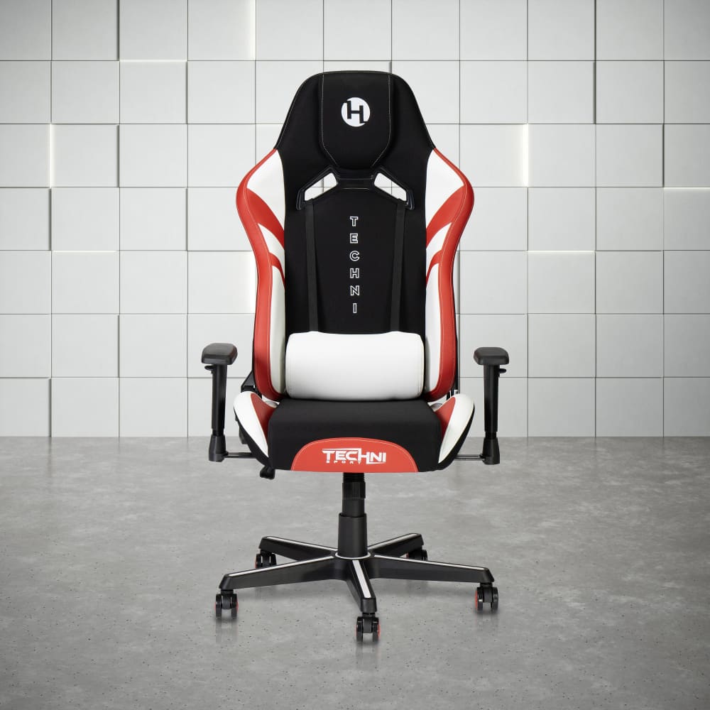 A black, red, and white gaming chair with a headrest pillow and lumbar support cushion.