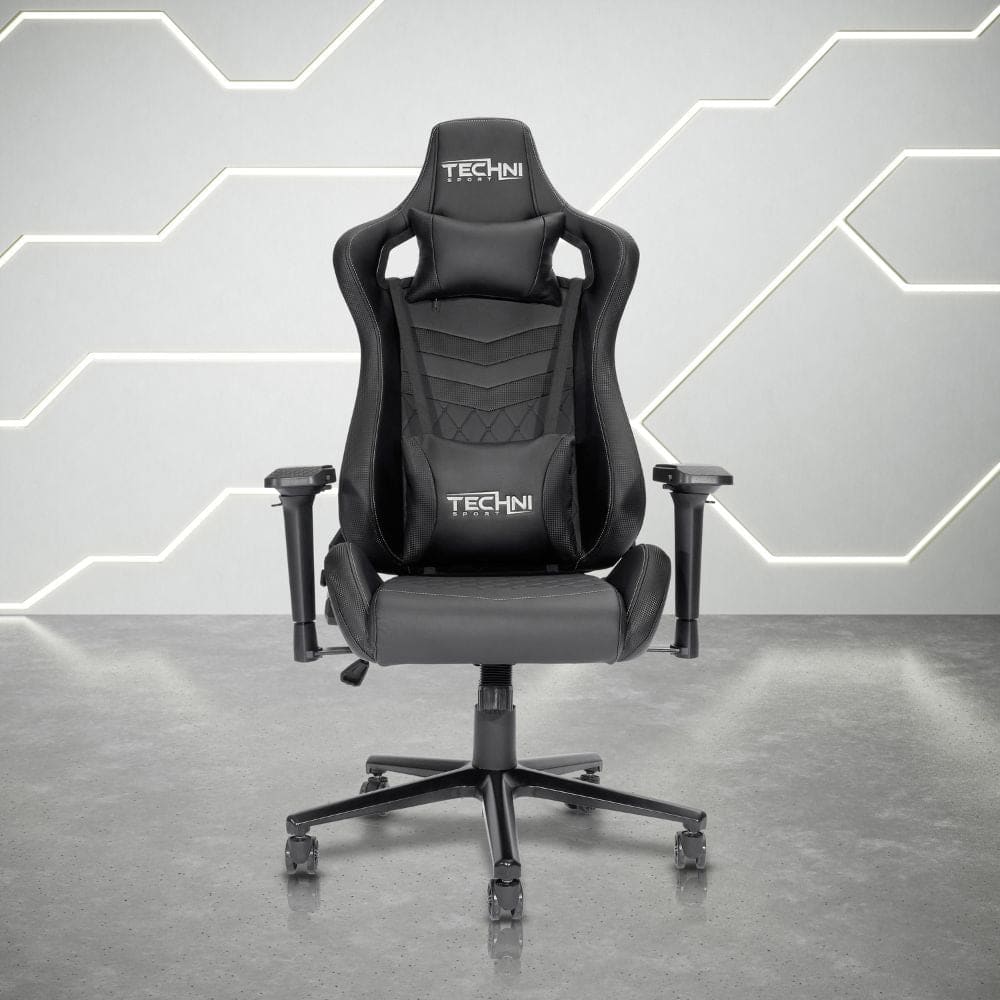Black gaming chair with headrest and lumbar support pillows.