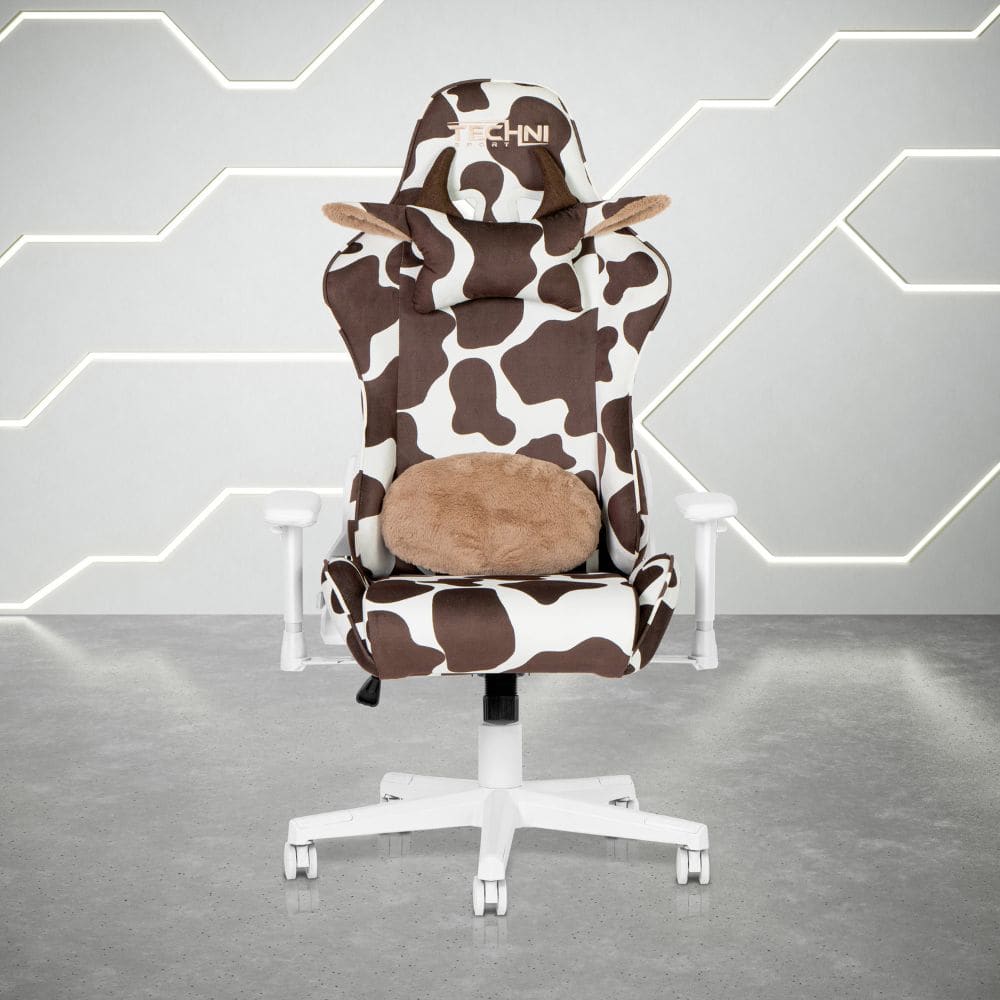 Cow print gaming chair with white base and brown lumbar pillow. 