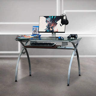 Glass-topped gaming desk with keyboard tray.