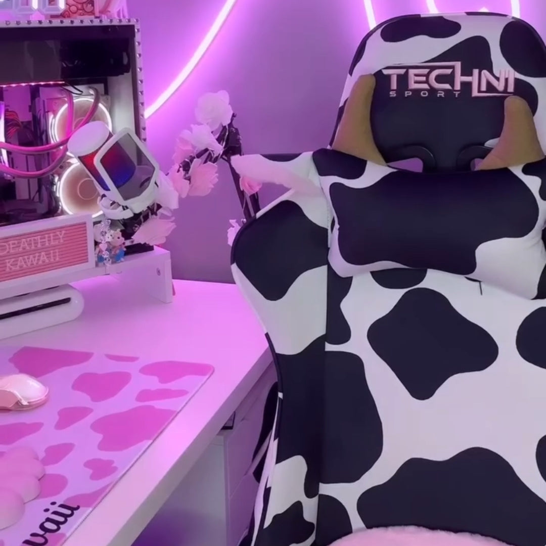 close up of cow print gaming chair in an LED lit gaming setup 