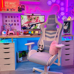 Cute gaming setup with a blue gaming chair, desk, and TV in a room with pink and purple lighting. 