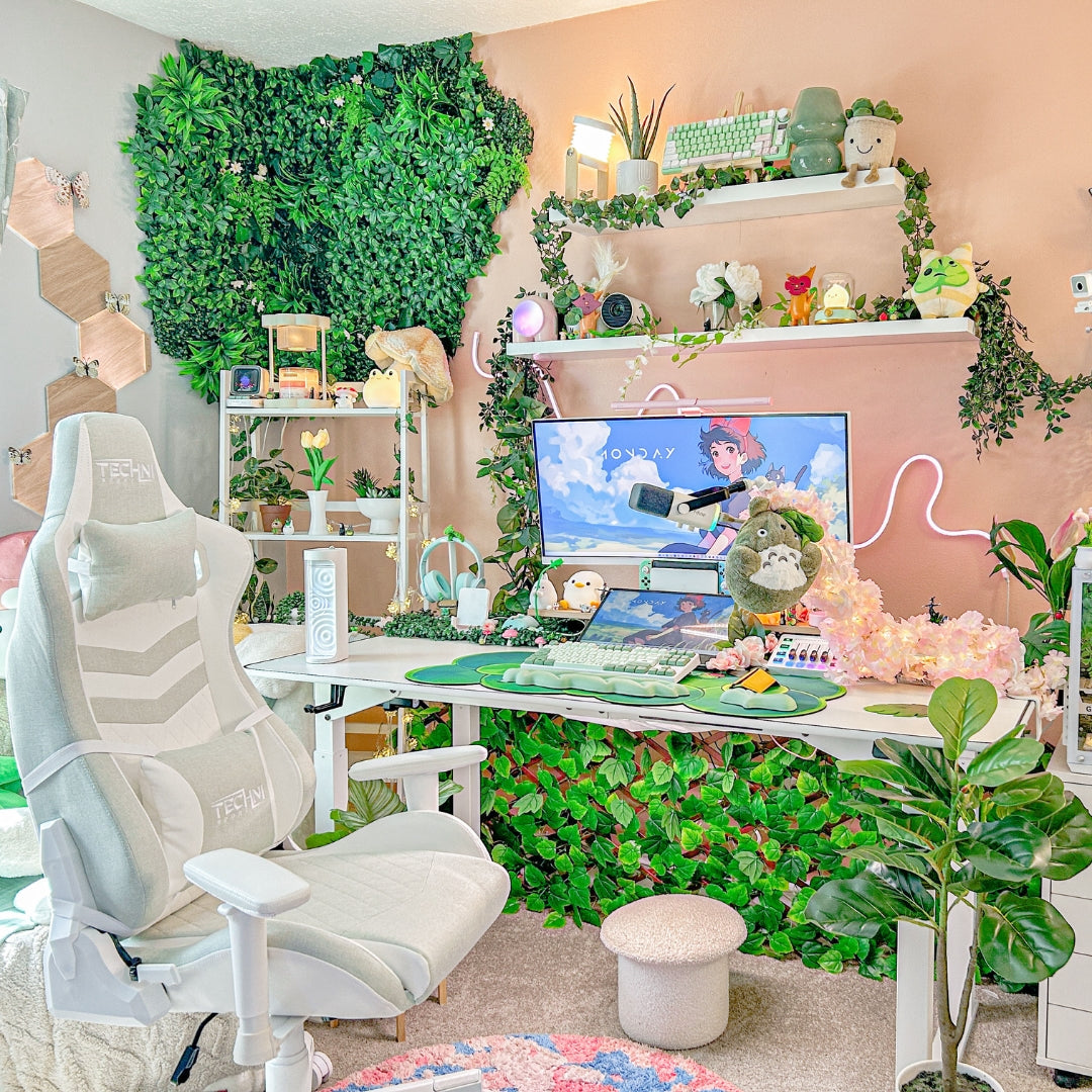 Cozy gaming space with plants, a mint gaming chair, and a computer setup. 